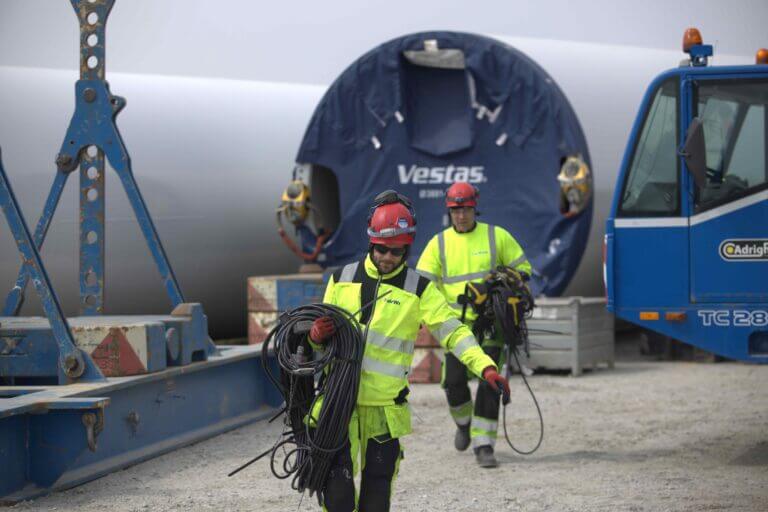 FairWind technicians carrying high-voltage cables during wind turbine electrical maintenance