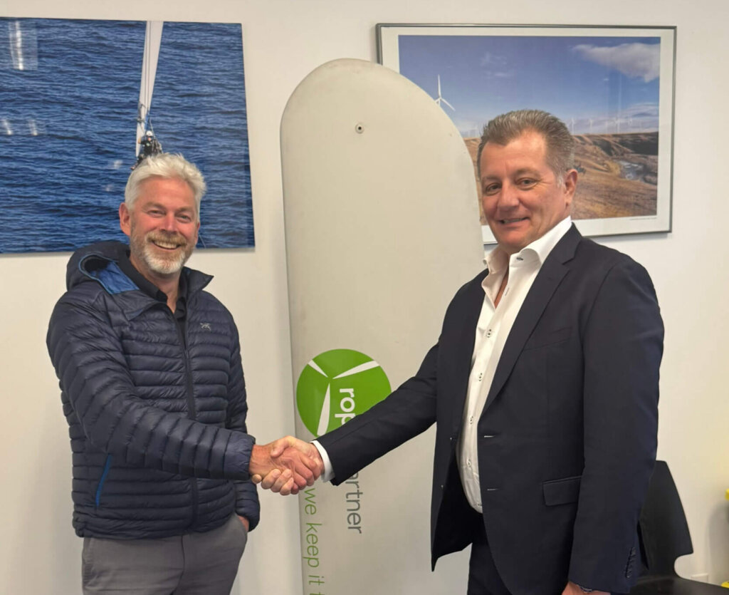 FairWind CEO, Stewart Mitchell and Rope Partner CEO, Eric Stanfield shaking hands over the acqusition of Rope Partner into FairWind