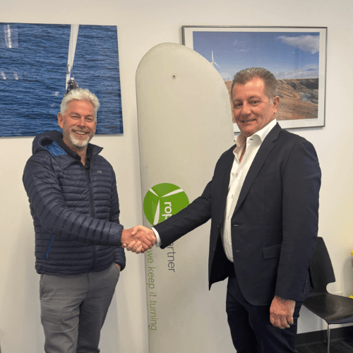 FairWind CEO, Stewart Mitchell and Rope Partner CEO, Eric Stanfield shaking hands over the acquisition of Rope Partner into FairWind